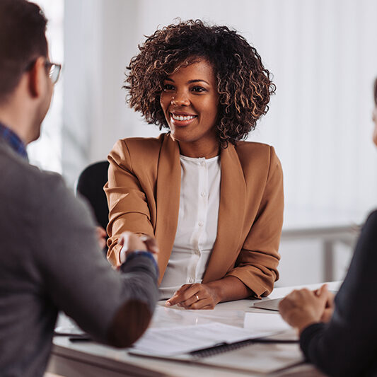 Business people shaking hands after meeting